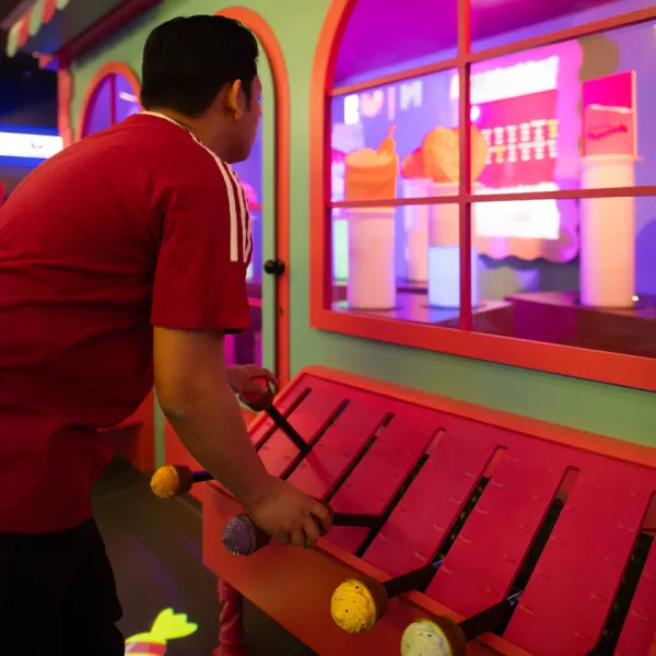 A player working the candy-shop levers in Candit