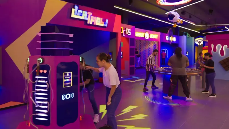 CUBE Arena — free-standing game units and teams mid-game on one open floor